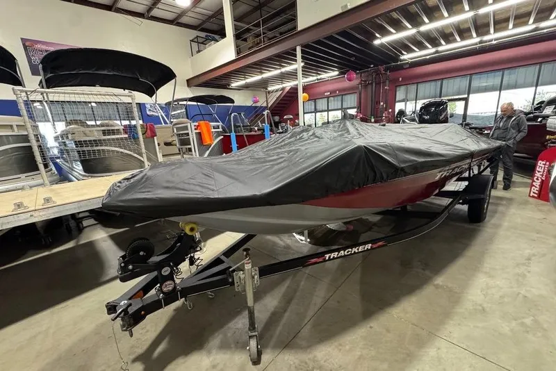 Slide: The Image of 2021 Tracker Pro Team 175 TXW boat covered in showroom, on trailer. - 41