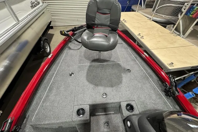 Slide: The Image of 2021 Tracker Pro Team 175 TXW boat interior with gray seating and red accents. - 44