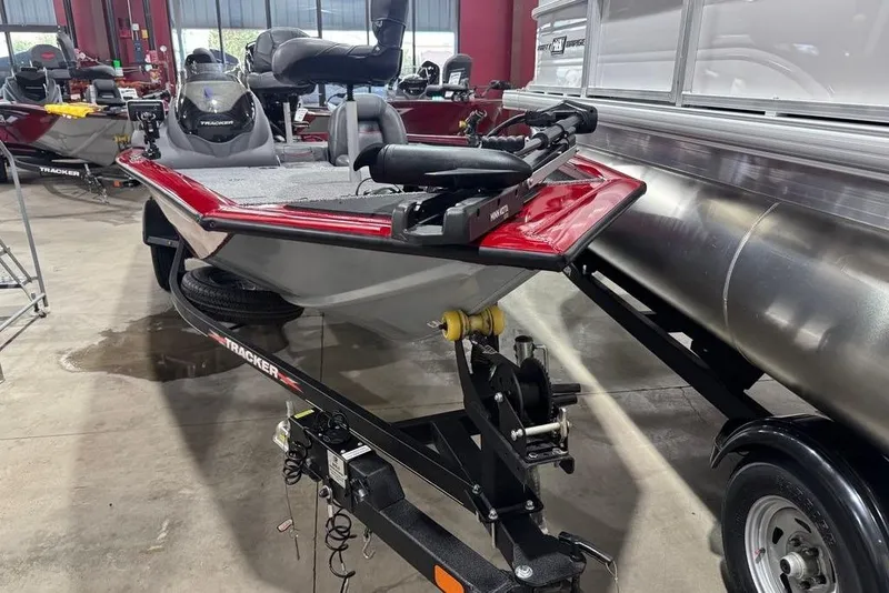 Slide: The Image of 2021 Tracker Pro Team 175 TXW boat on trailer in showroom. - 5