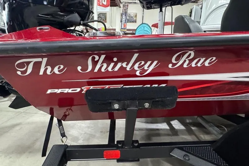 Slide: The Image of Red 2021 Tracker Pro Team 175 TXW boat named "The Shirley Rae" in showroom. - 7