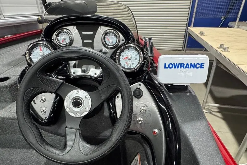 Slide: The Image of 2021 Tracker Pro Team 175 TXW boat dashboard with Lowrance fish finder and gauges. - 8