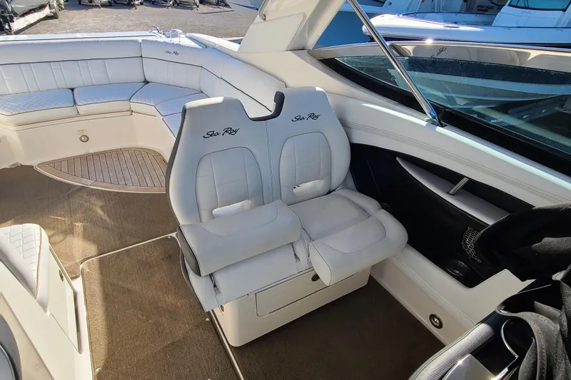 Slide: The Image of Interior of 2014 Sea Ray 350 SLX boat with white seating and carpeted floor. - 15