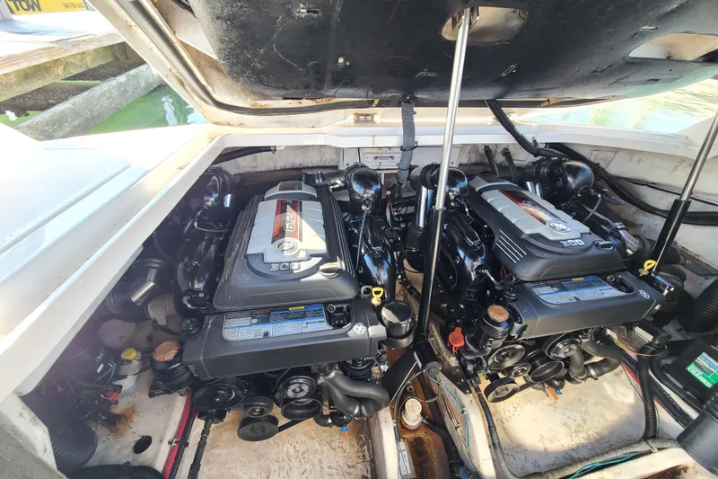 Slide: The Image of Engine compartment of a 2014 Sea Ray 350 SLX boat, featuring dual engines. - 22