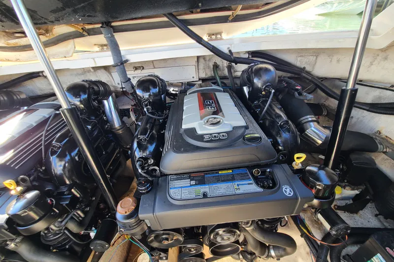 Slide: The Image of Engine compartment of a 2014 Sea Ray 350 SLX boat, featuring a powerful 6.2L engine. - 24