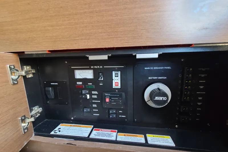 Slide: The Image of Electrical control panel of a 2014 Sea Ray 350 SLX boat, featuring switches and gauges. - 5