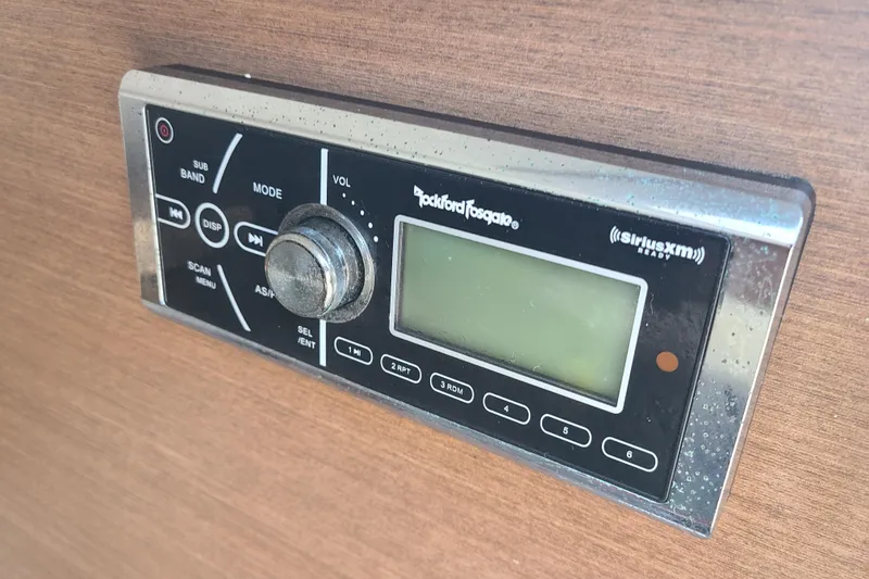 Slide: The Image of Rockford Fosgate SiriusXM radio on 2014 Sea Ray 350 SLX boat dashboard. - 6