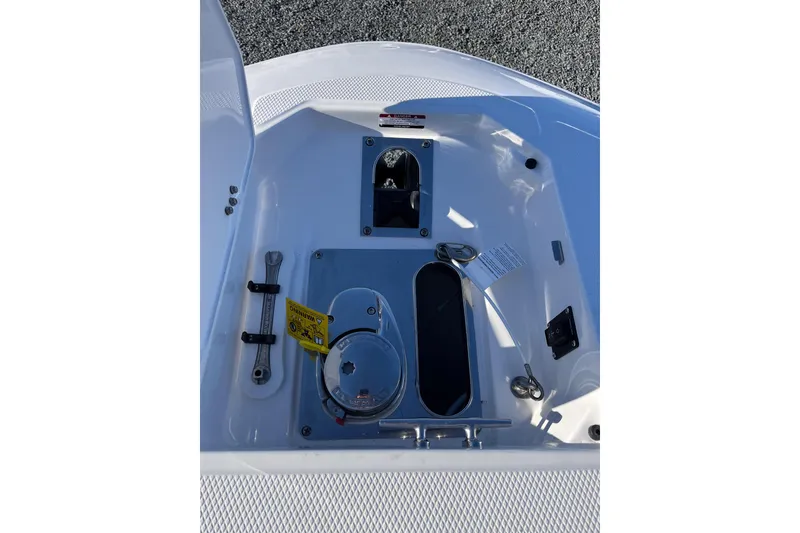 Slide: The Image of 2026 Robalo R257 Dual Console boat deck with storage and control features. - 14