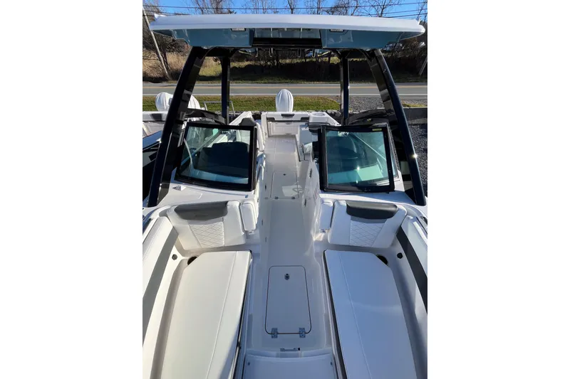 Slide: The Image of 2026 Robalo R257 Dual Console boat interior with seating and windshield. - 15