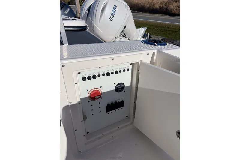 Slide: The Image of 2026 Robalo R257 Dual Console boat control panel with Yamaha engines in background. - 19