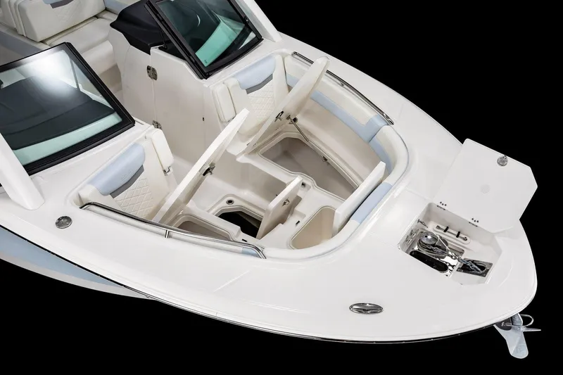 Slide: The Image of 2026 Robalo R257 Dual Console boat interior with open storage compartments. - 4