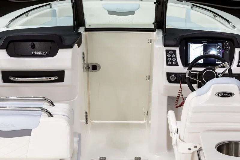 Slide: The Image of 2026 Robalo R257 Dual Console boat seating area with sleek design and comfortable upholstery. - 5
