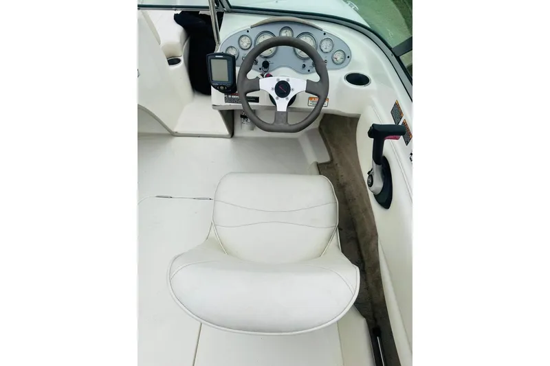 Slide: The Image of 2008 Maxum 1800 MX boat cockpit with steering wheel and gauges. - 6