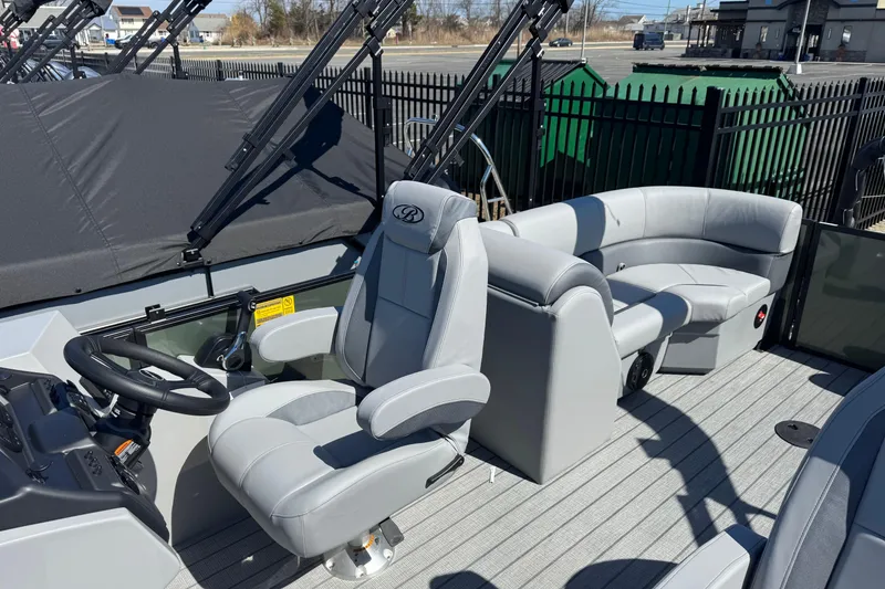 Slide: The Image of 2026 Bentley Pontoons Legacy 223 Navigator interior with luxurious seating and modern helm. - 10