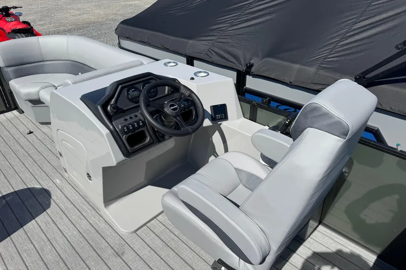 Slide: The Image of 2026 Bentley Pontoons Legacy 223 Navigator helm with modern controls and comfortable seating. - 9