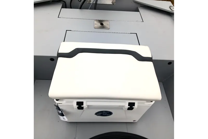 Slide: The Image of 2026 Tracker Bass Tracker Classic CC boat interior with white cooler. - 13