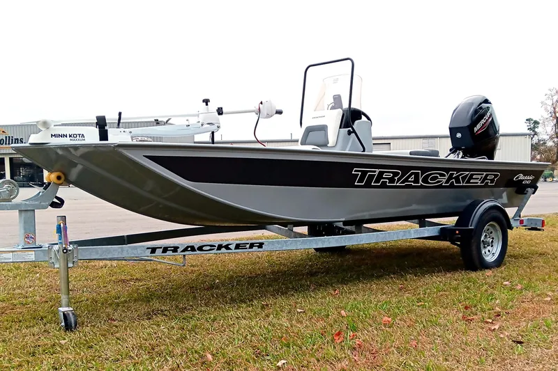 Slide: The Image of 2026 Tracker Bass Tracker Classic CC boat on trailer, featuring Minn Kota motor. - 5