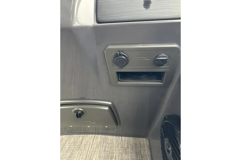 Slide: The Image of Control panel of 2026 Bennington S Quad Bench 22 SSR boat interior. - 11