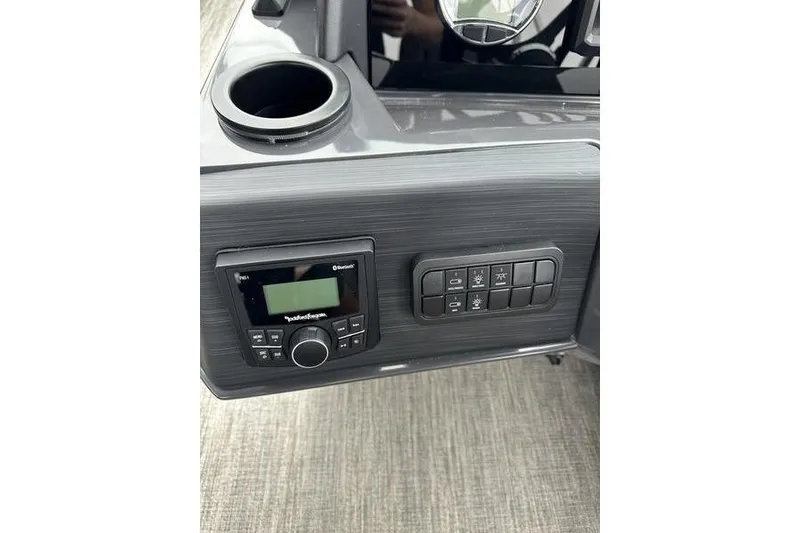 Slide: The Image of Control panel of 2026 Bennington S Quad Bench 22 SSR with audio system and switches. - 12