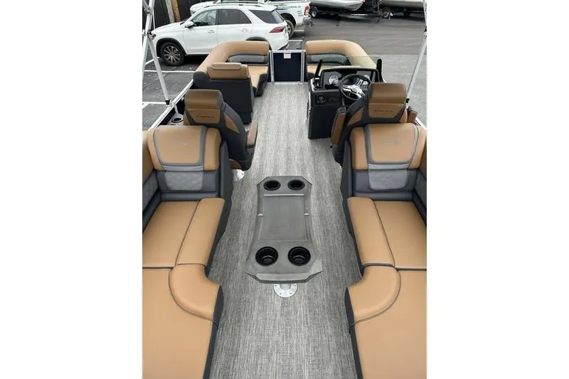 Slide: The Image of 2026 Bennington S Quad Bench 22 SSR interior with tan and gray seating, modern design. - 13