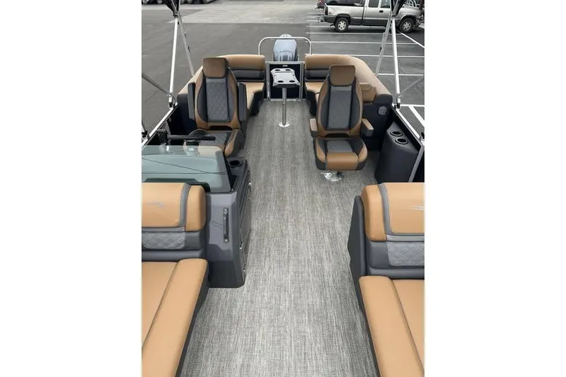 Slide: The Image of 2026 Bennington S Quad Bench 22 SSR interior with tan and gray seating, spacious layout. - 6