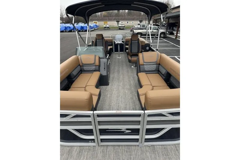 Slide: The Image of 2026 Bennington S Quad Bench 22 SSR pontoon boat with spacious seating and modern design. - 9