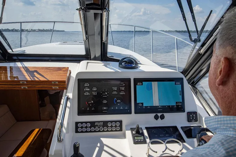 Slide: The Image of Cockpit view of 2026 MJM 47 R yacht with advanced navigation displays. - 5
