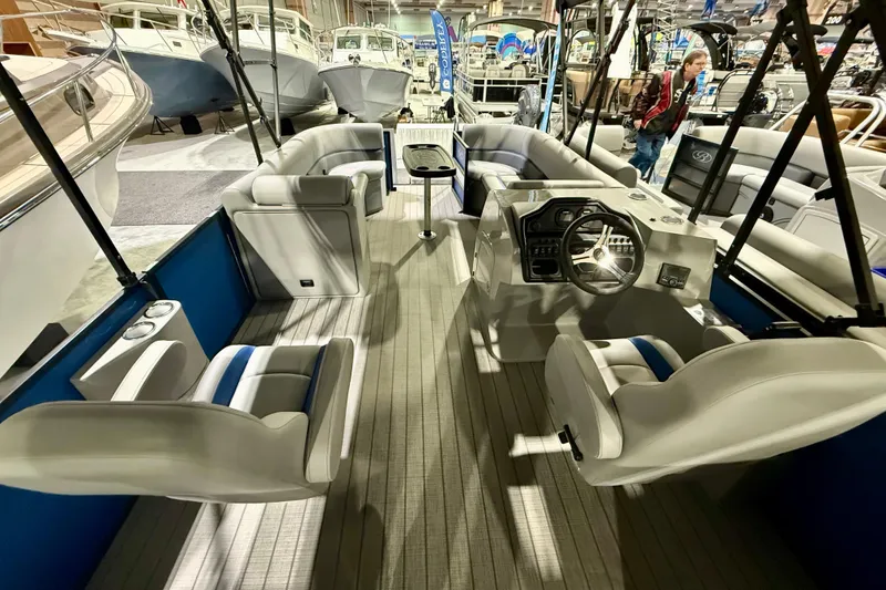 Slide: The Image of 2025 Bentley Pontoons Legacy 243 Navigator interior with luxurious seating and modern design. - 4