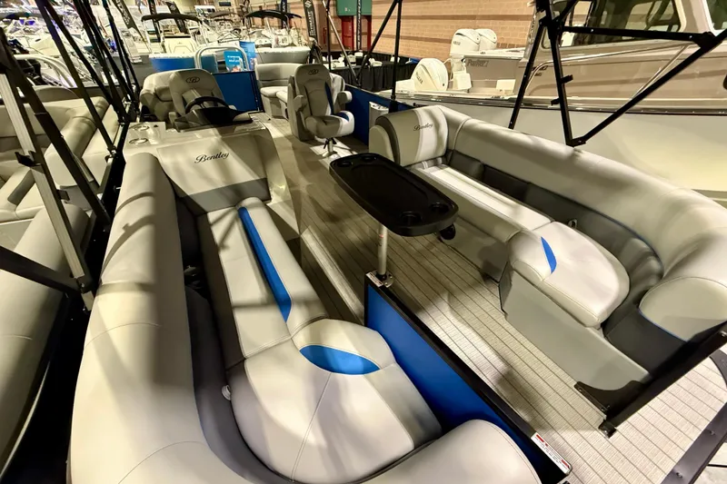 Slide: The Image of 2025 Bentley Pontoons Legacy 243 Navigator interior with luxurious seating and modern design. - 5