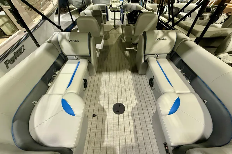 Slide: The Image of 2025 Bentley Pontoons Legacy 243 Navigator interior with luxurious seating and modern helm. - 6