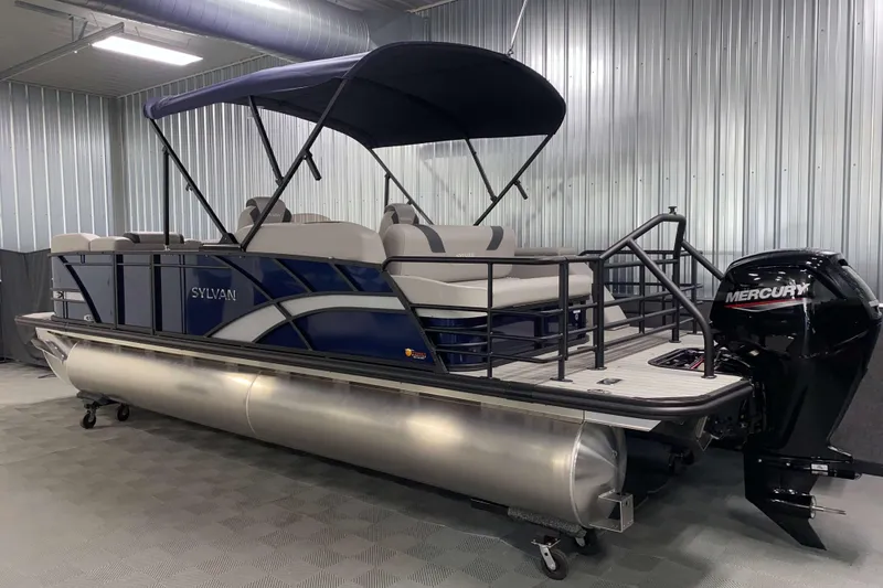 Slide: The Image of 2025 Sylvan L3 CLZ DH pontoon boat with Mercury outboard in a showroom. - 17