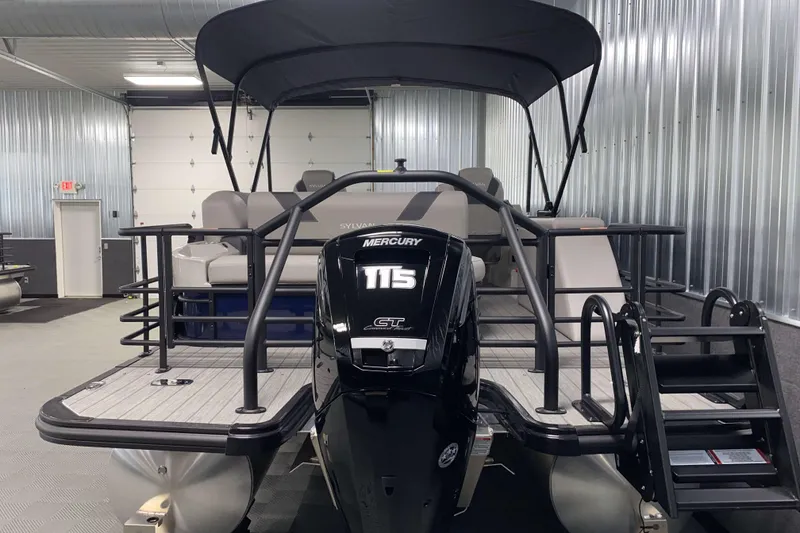 Slide: The Image of 2025 Sylvan L3 CLZ DH pontoon boat with Mercury 115 engine in a showroom. - 18