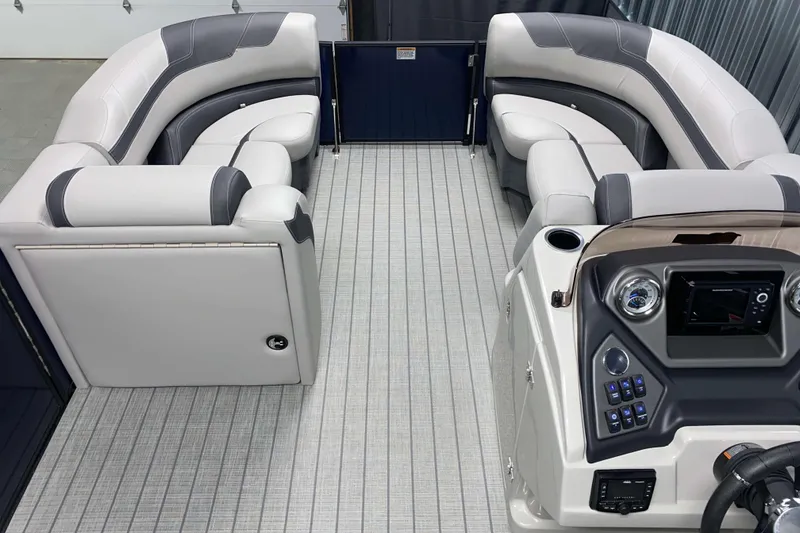 Slide: The Image of Luxurious interior of 2025 Sylvan L3 CLZ DH pontoon boat with plush seating and modern dashboard. - 4