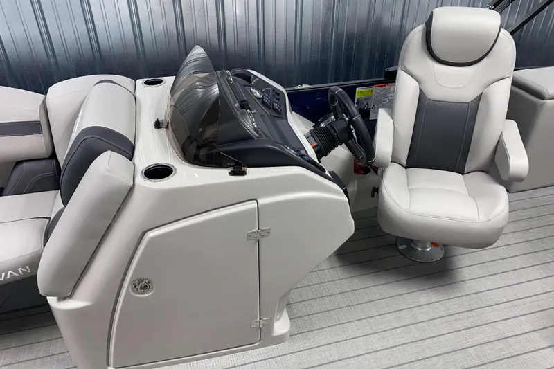 Slide: The Image of 2025 Sylvan L3 CLZ DH boat interior with sleek helm and comfortable seating. - 6