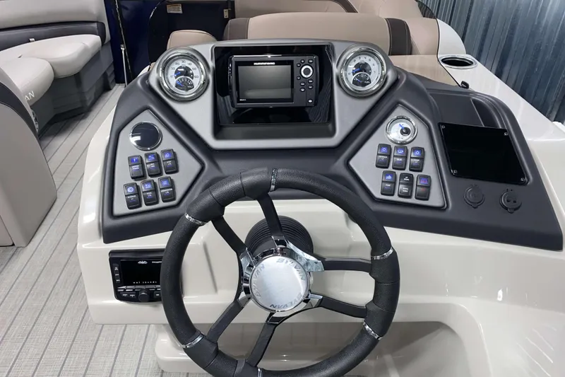 Slide: The Image of 2025 Sylvan L3 CLZ DH boat dashboard with steering wheel and control panel. - 9