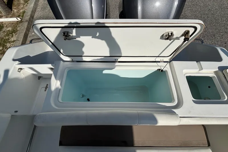 Slide: The Image of Open storage compartment on 2012 Sea Hunt Gamefish 29 boat, showing interior details. - 10