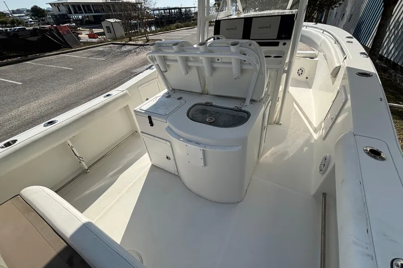 Slide: The Image of 2012 Sea Hunt Gamefish 29 boat interior with helm and seating area. - 12