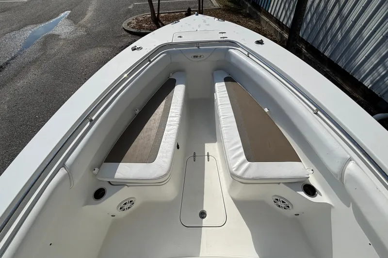 Slide: The Image of 2012 Sea Hunt Gamefish 29 boat interior with cushioned seating and speakers. - 24