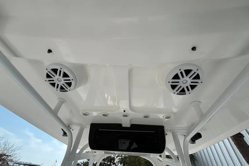 Slide: The Image of 2012 Sea Hunt Gamefish 29 boat ceiling with speakers and rod holders. - 29
