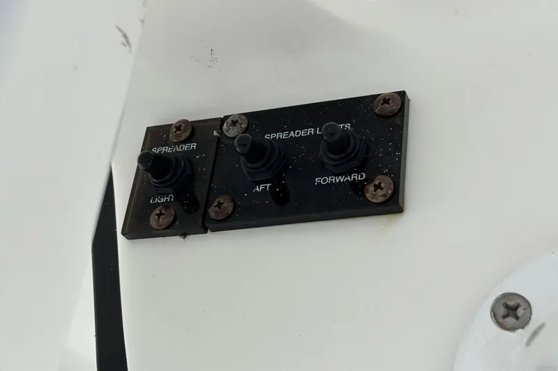 Slide: The Image of Control panel on a 2012 Sea Hunt Gamefish 29 boat with spreader light switches. - 31