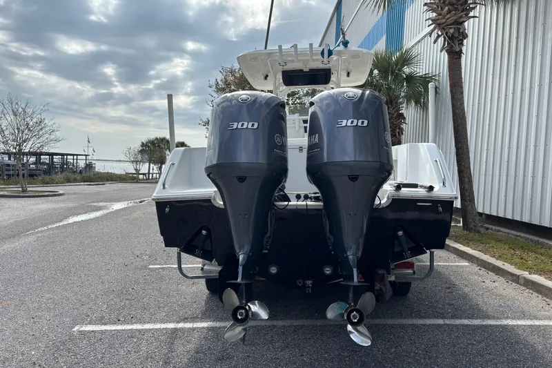 Slide: The Image of 2012 Sea Hunt Gamefish 29 with twin Yamaha 300 engines in a parking lot. - 8