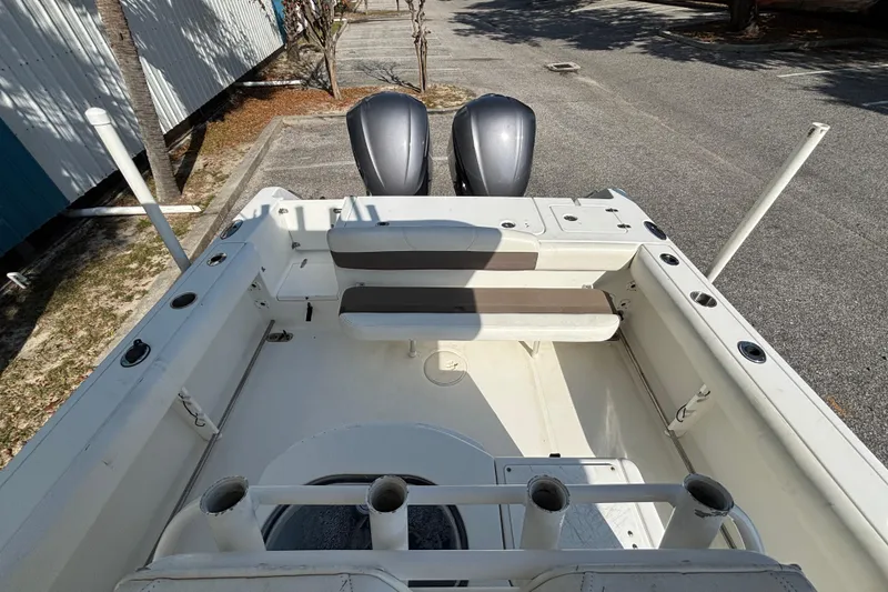 Slide: The Image of 2012 Sea Hunt Gamefish 29 boat interior with dual engines and seating area. - 9