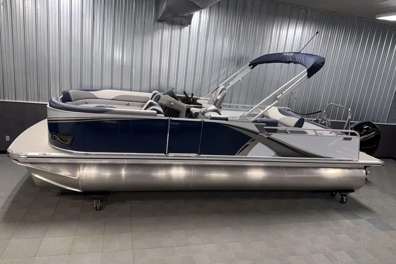 The Image of 2026 Avalon LSZ 2385 VRB pontoon boat in showroom, featuring sleek design and modern amenities. - 0