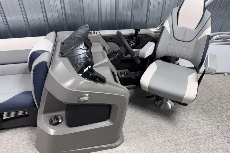 Slide: The Image of 2026 Avalon LSZ 2385 VRB boat interior with modern helm and comfortable captain's chair. - 13