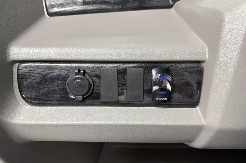 Slide: The Image of 2026 Avalon LSZ 2385 VRB control panel with 12V outlet and up/down switch. - 20