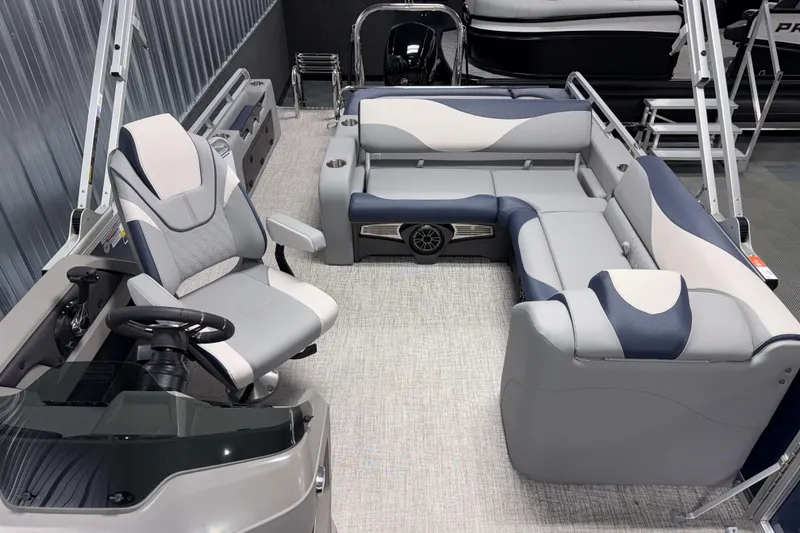 Slide: The Image of 2026 Avalon LSZ 2385 VRB pontoon boat interior with modern seating and steering console. - 22