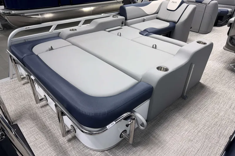 Slide: The Image of 2026 Avalon LSZ 2385 VRB pontoon boat interior with luxurious seating and cup holders. - 26