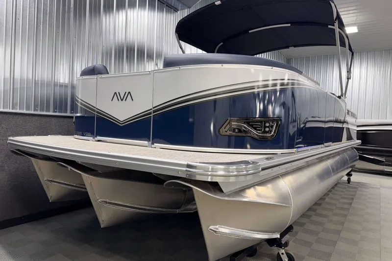 Slide: The Image of 2026 Avalon LSZ 2385 VRB pontoon boat in showroom, featuring sleek design and modern amenities. - 3