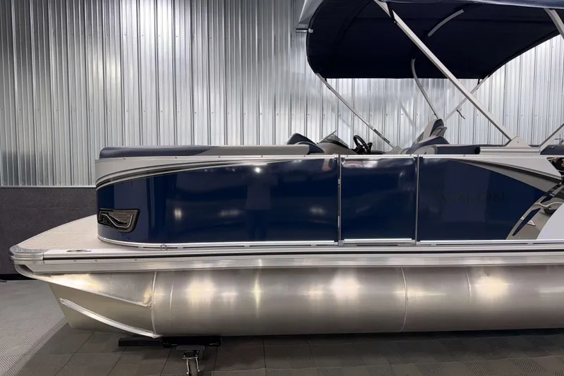 Slide: The Image of 2026 Avalon LSZ 2385 VRB pontoon boat with sleek blue design and canopy. - 5