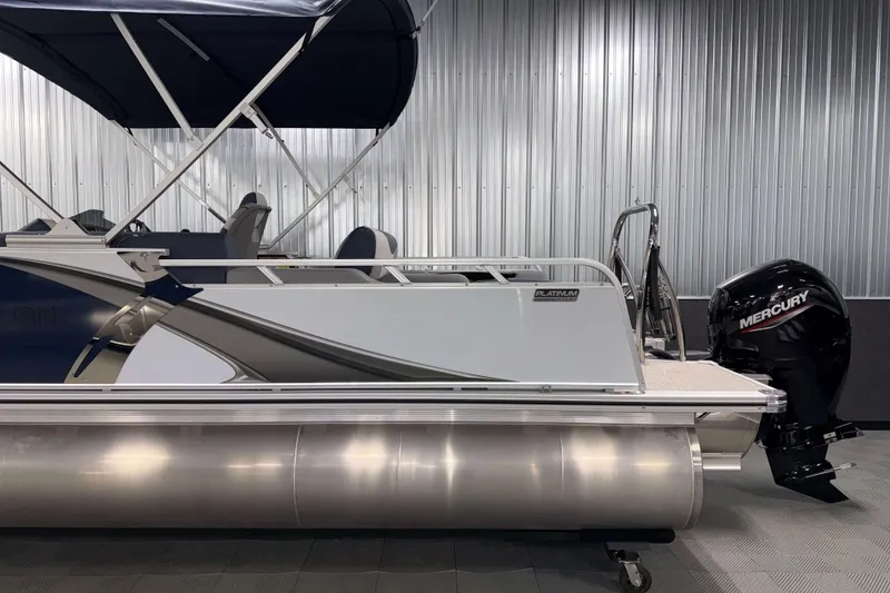 Slide: The Image of 2026 Avalon LSZ 2385 VRB pontoon boat with Mercury outboard motor in showroom. - 6