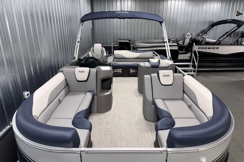 Slide: The Image of 2026 Avalon LSZ 2385 VRB pontoon boat with luxurious seating in a showroom. - 8